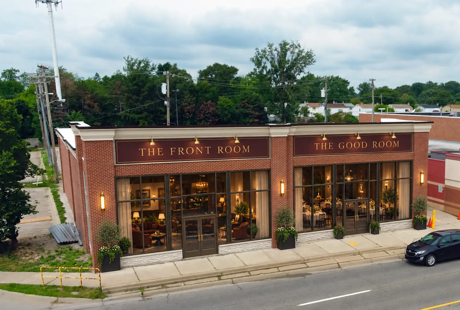 Proposed exterior transformation with Front Room and Good Room signage, warm interior light and planters