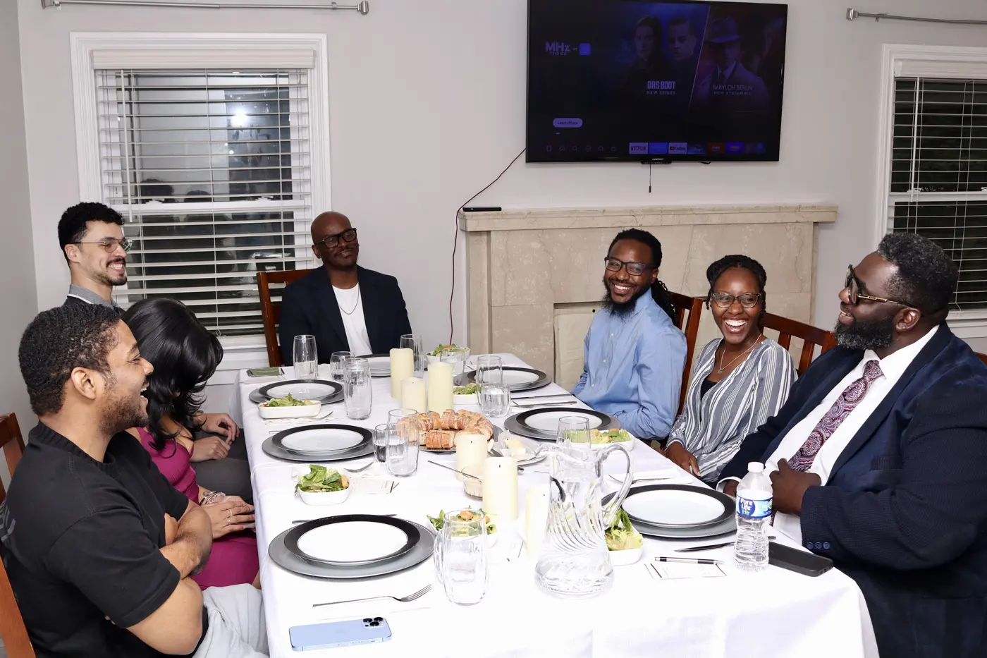 Guests sharing conversation around the dinner table