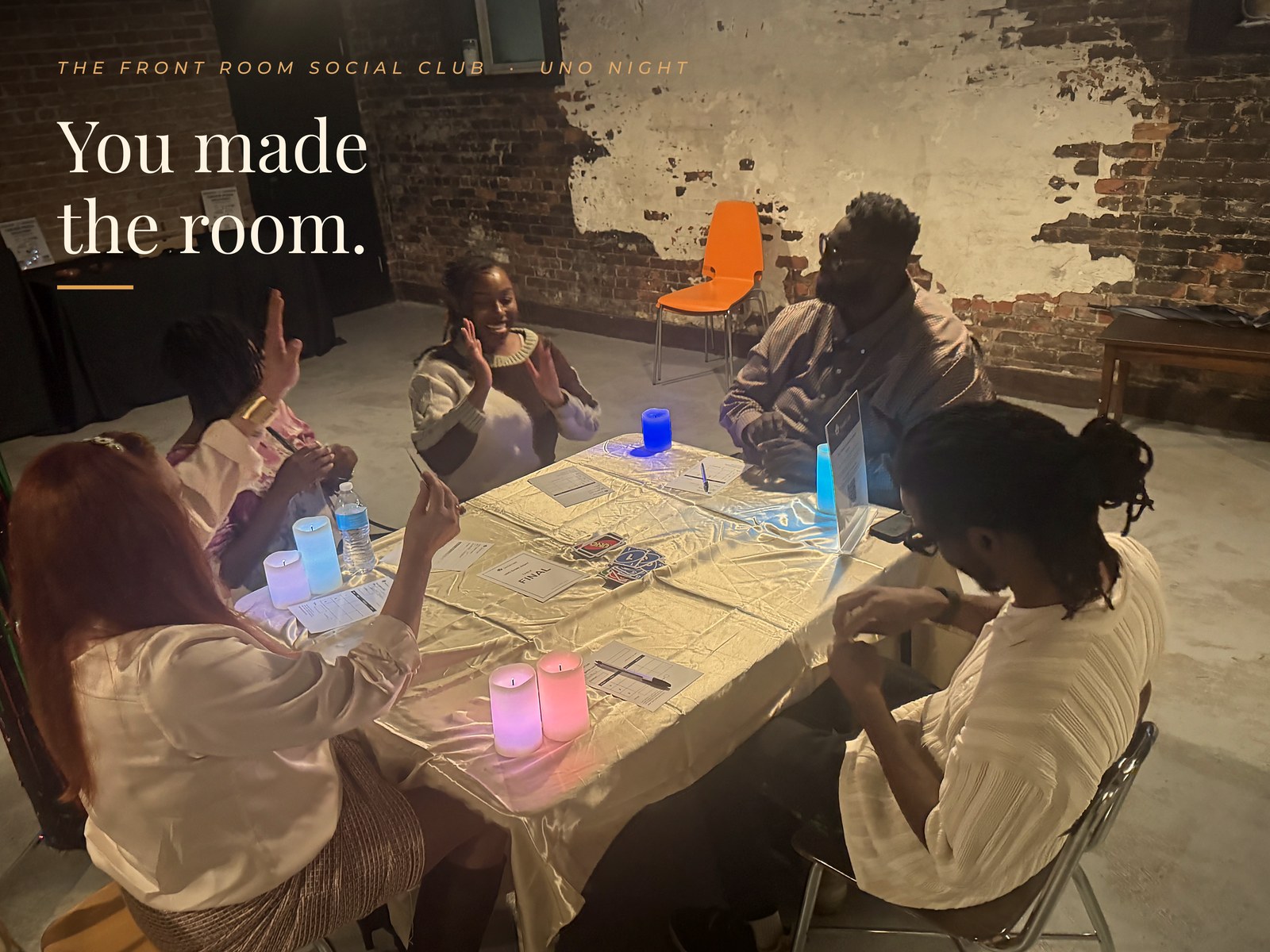 An UNO table at The Front Room Social Club’s UNO night with the words You made the room.